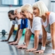 Image of a group of seniors doing push-ups in an exercise class.