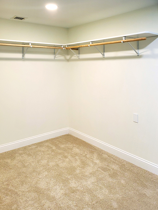 Image of the inside of a new, empty closet.