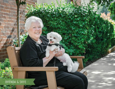 Roland Park Place resident, Brenda, and her dog, Skye