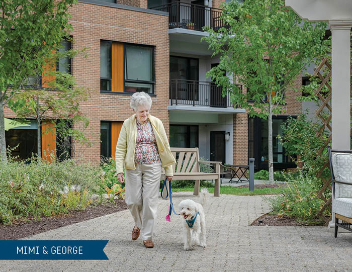 Mimi (resident) and George (her dog) taking a walk through Roland Park Place