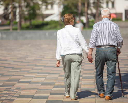 senior couple with limited mobility on a vacation together